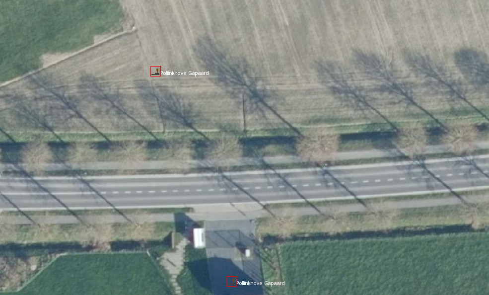 Aerial imagery of a rural area, bus stops are located in the middle of fields