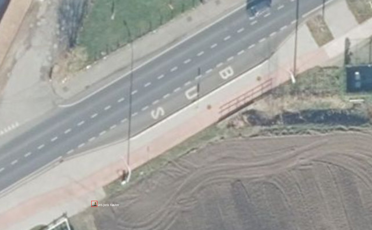 Aerial imagery showing a bus bay along a sidewalk, and a stop node several dozen meters further away